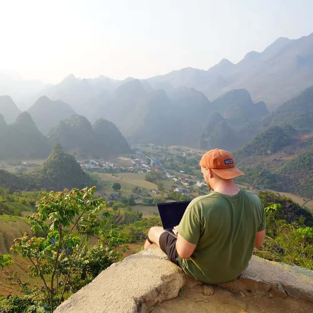 Alec Winter standing on a cliff in Vietnam